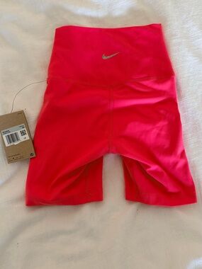 Nike women's coral high waist 7" bike shorts.